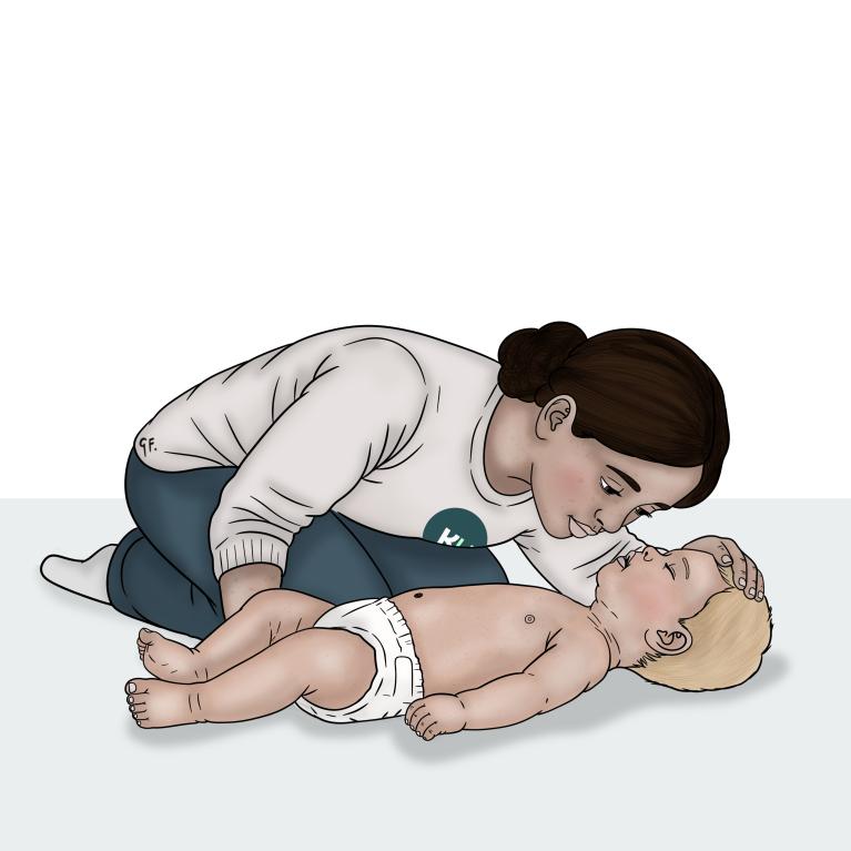 A woman leans close to a baby’s face to check and feel for breathing while keeping one hand on the baby’s forehead.