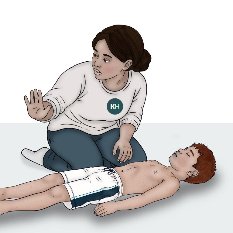 A woman kneels beside a child lying on their back and holds out one hand as she checks the area around them.