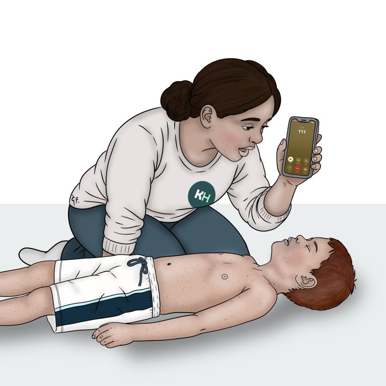 A woman kneels beside a child lying on their back and speaks into a phone showing a call to 111.