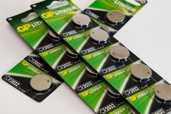 A photo of lithium button batteries in a green packet