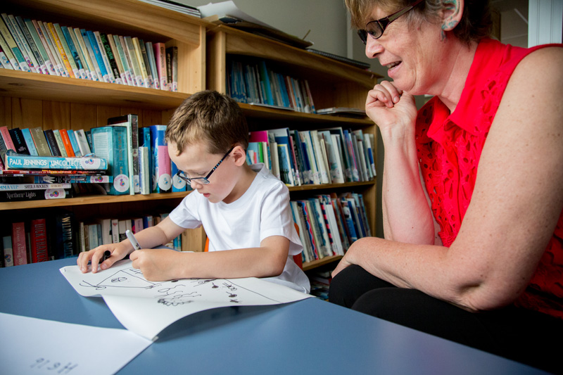 A boy and his teacher at school