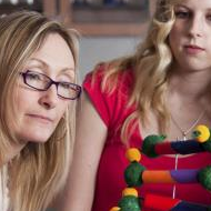 2 women looking at a classroom model