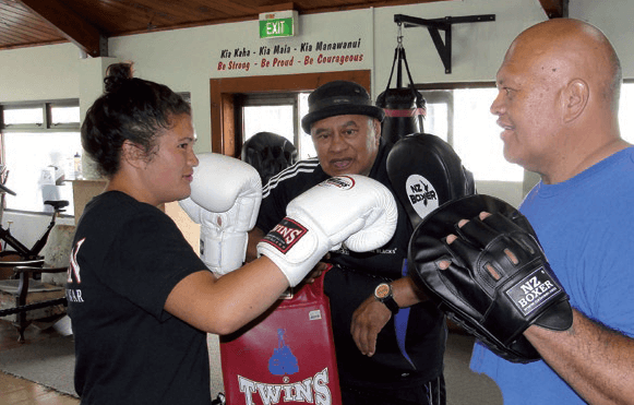 A teenager boxing