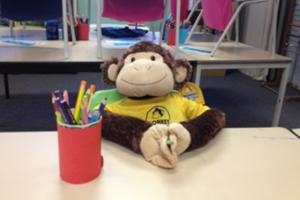 Monkey toy in a chair