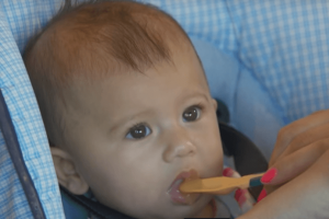 Baby eating from a spoon