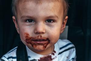 Child with food smeared around mouth