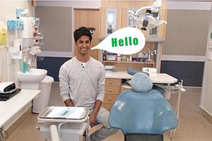 A dental therapist sitting in a chair 