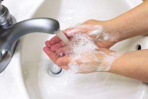 Washing hands in basin