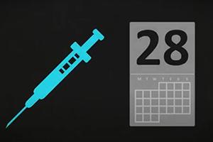 A needle and a calendar with the number 28