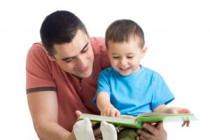 Father reading to his son